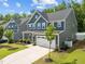 Attractive two-story home featuring a well-maintained lawn, two-car garage, and appealing exterior at 168 Amber Acorn Ave, Raleigh, NC 27603