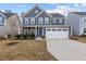 Beautiful two-story home with a well-manicured lawn and attached two-car garage at 168 Amber Acorn Ave, Raleigh, NC 27603