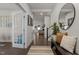 Bright foyer with hardwood floors, white trim, and view to the living room at 168 Amber Acorn Ave, Raleigh, NC 27603