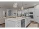 Open kitchen featuring stainless steel appliances, white cabinets, large center island, and pendant lighting at 168 Amber Acorn Ave, Raleigh, NC 27603