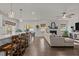 Open-concept living room and dining area with a fireplace, and hardwood floors at 168 Amber Acorn Ave, Raleigh, NC 27603