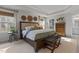 Bright main bedroom featuring a large bed, tray ceiling, and natural lighting at 168 Amber Acorn Ave, Raleigh, NC 27603