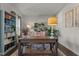 Bright home office featuring natural light, custom shelving, and a work desk at 168 Amber Acorn Ave, Raleigh, NC 27603
