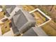 Aerial view of the home showing the roof, backyard with white fence, and surrounding neighborhood at 168 Amber Acorn Ave, Raleigh, NC 27603