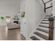 Elegant staircase with wood treads and white risers leading to the upper level at 168 Amber Acorn Ave, Raleigh, NC 27603
