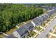 Aerial street view featuring well-maintained homes, manicured lawns, and lush green trees at 168 Amber Acorn Ave, Raleigh, NC 27603