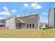 Spacious backyard with manicured lawn and a cozy screened-in porch at 170 Creekhaven Dr, Angier, NC 27501