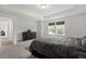 Spacious bedroom with large window and tray ceilings at 170 Creekhaven Dr, Angier, NC 27501