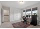 Bright bedroom with carpet, home office setup and dual windows with blinds at 170 Creekhaven Dr, Angier, NC 27501