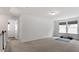 Bright, carpeted bonus room with dual windows and a staircase at 170 Creekhaven Dr, Angier, NC 27501