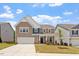 Charming two-story home showcasing a well-manicured front yard and attached two car garage at 170 Creekhaven Dr, Angier, NC 27501
