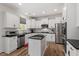 Contemporary kitchen with white cabinets, stainless steel appliances, and dark countertops at 170 Creekhaven Dr, Angier, NC 27501