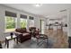 Open floor plan featuring a spacious living room connecting to a modern kitchen with an island at 170 Creekhaven Dr, Angier, NC 27501
