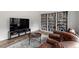 Cozy living room featuring a large built-in bookcase and comfortable seating area at 170 Creekhaven Dr, Angier, NC 27501