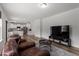 Inviting living room with hardwood floors and an open concept to the modern kitchen at 170 Creekhaven Dr, Angier, NC 27501