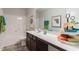 Bathroom featuring a bathtub and shower, large mirror, and white countertop at 171 Alice Trace Place, Angier, NC 27501
