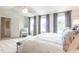 Bright bedroom boasting three windows, carpeted floors, and neutral paint at 171 Alice Trace Place, Angier, NC 27501