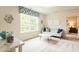 Bonus room features neutral paint and carpet, a window and couch with pillows at 171 Alice Trace Place, Angier, NC 27501