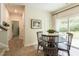 Dining area boasts a round table, four chairs, and sliding glass doors at 171 Alice Trace Place, Angier, NC 27501