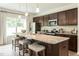 Kitchen with granite countertops, stainless steel appliances, and a center island at 171 Alice Trace Place, Angier, NC 27501