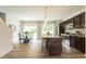 Spacious kitchen with stainless steel appliances, dark wood cabinets and eat in breakfast area at 171 Alice Trace Place, Angier, NC 27501