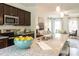 Bright, spacious kitchen with granite counters, a large island and stainless steel appliances at 171 Alice Trace Place, Angier, NC 27501