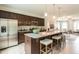 Modern kitchen with granite counters, stainless steel appliances and an island with seating at 171 Alice Trace Place, Angier, NC 27501