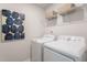 The laundry room features a side-by-side washer and dryer, plus shelving at 171 Alice Trace Place, Angier, NC 27501