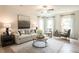 Bright living room featuring a comfortable sofa, armchairs, and stylish decor at 171 Alice Trace Place, Angier, NC 27501