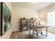 Home office features a modern desk, shelving, and natural light from a window at 171 Alice Trace Place, Angier, NC 27501