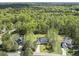 Beautiful aerial view of a home nestled among lush greenery, showcasing its expansive surroundings and neighborhood setting at 1723 River Club Way, Franklinton, NC 27525