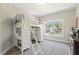 Unique bedroom with a lofted bed and integrated desk, ample storage, and natural light at 1723 River Club Way, Franklinton, NC 27525