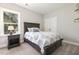 Cozy bedroom with plush carpet, a large window and a comfortable bed with decorative pillows at 1723 River Club Way, Franklinton, NC 27525