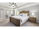 Spacious main bedroom with tray ceiling, neutral carpet, and ensuite bathroom at 1723 River Club Way, Franklinton, NC 27525