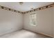 Bedroom with neutral walls features a large window at 1725 Briarforest Pl, Raleigh, NC 27615