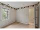 Cozy bedroom with a decorative border, offering a serene and inviting atmosphere at 1725 Briarforest Pl, Raleigh, NC 27615