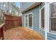Beautiful wood deck, perfect for outdoor dining and entertaining with glass pane doors to the home at 1725 Briarforest Pl, Raleigh, NC 27615
