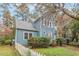 Charming two-story home featuring blue siding and a well-maintained front yard with a white picket fence at 1725 Briarforest Pl, Raleigh, NC 27615