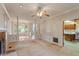Open-concept living space with fireplace and access to dining room and kitchen at 1725 Briarforest Pl, Raleigh, NC 27615