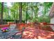 Relax on the spacious back deck with tranquil views of lush greenery at 1805 Holly St, Apex, NC 27502