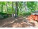 Spacious backyard with a brick path to a lower deck area at 1805 Holly St, Apex, NC 27502