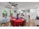 Bright dining area with views of the deck, hardwood flooring, and access to the kitchen at 1805 Holly St, Apex, NC 27502