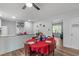 View of the dining area leading into the kitchen, featuring hardwood floors and natural light at 1805 Holly St, Apex, NC 27502