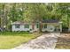 Charming single-story home with a well-maintained lawn and green shutters at 1805 Holly St, Apex, NC 27502