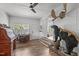 Bright and airy living room featuring unique taxidermy, a desk, and an open doorway at 1805 Holly St, Apex, NC 27502