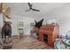 Unique living room filled with taxidermy, roll-top desk and a ceiling fan at 1805 Holly St, Apex, NC 27502