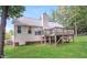 Lush backyard features deck, mature trees, and a well-maintained lawn, offering privacy and space at 1808 Betry Pl, Raleigh, NC 27603