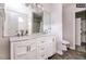 Bathroom with marble countertops, double vanity sinks, and modern fixtures at 1808 Betry Pl, Raleigh, NC 27603