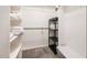 Walk-in closet featuring built-in shelving, hanging rods, and carpet flooring at 1808 Betry Pl, Raleigh, NC 27603