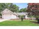 Attractive home with a well-maintained lawn, appealing curb appeal, and attached garage at 1808 Betry Pl, Raleigh, NC 27603
